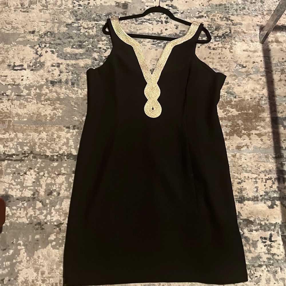 Woman’s Black and a gold party dress. Size 18.